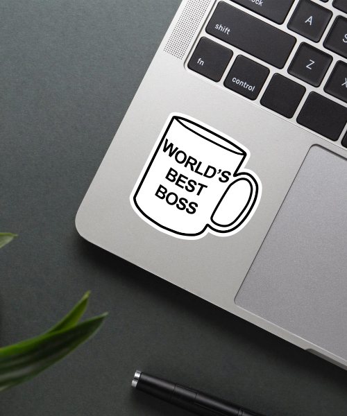 worlds best boss sticker on laptop surface showing clear text and coffee mug shape