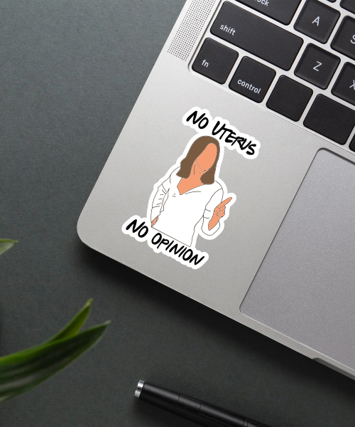 no uterus no opinion sticker on laptop surface showing bold feminist message