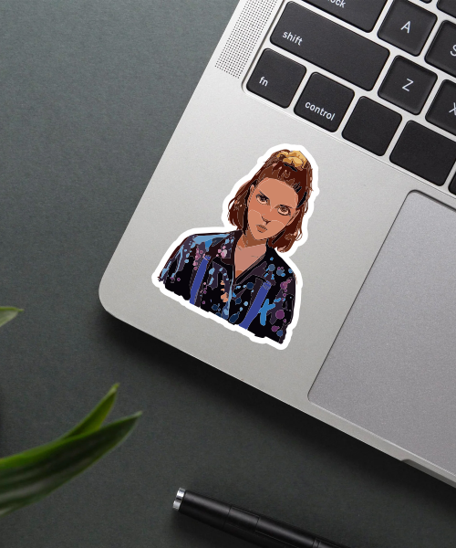 eleven nose bleed sticker on laptop surface showing colorful splashes and character image