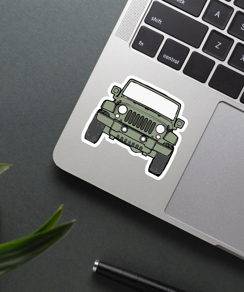 Mockup of jeep drive travel sticker on a laptop showing green offroad vehicle