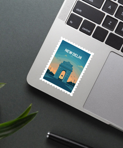 Mockup of travel sticker New Delhi India showing India Gate design on laptop surface