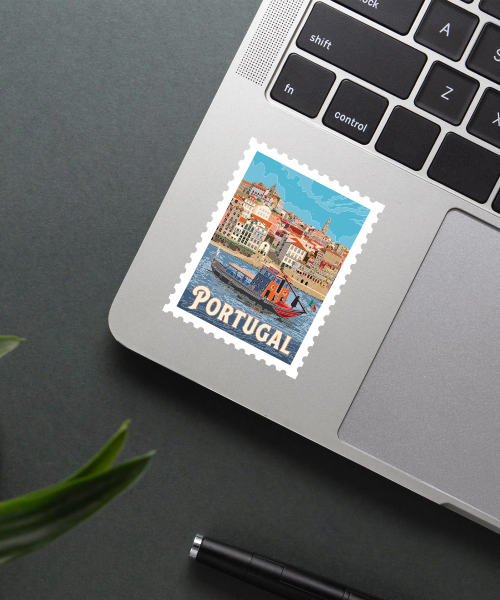 portugal travel sticker on laptop showing porto riverside and colorful buildings