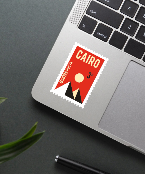 Mockup showing Cairo Travel Sticker on laptop with red and black colors