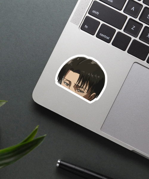 levi ackerman anime sticker on laptop surface showing intense half face
