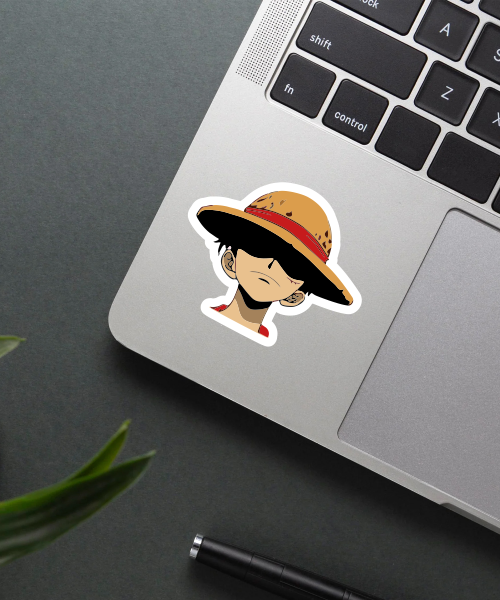 straw hat luffy anime sticker on phone surface showing serious expression
