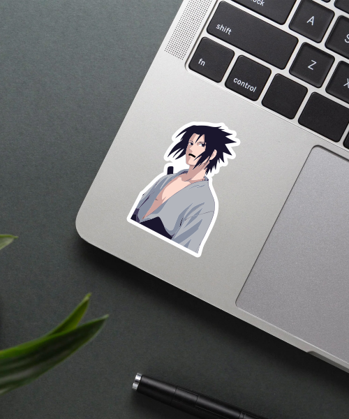 sasuke uchiha anime sticker on laptop surface showing serious ninja pose