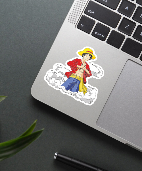 one piece anime sticker of luffy with smoke effect on laptop surface