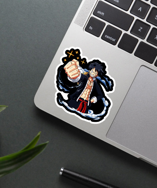 monkey d luffy sticker on laptop surface showing action pose and water effects