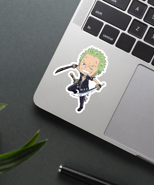 roronoa zoro chibi one piece sticker on laptop surface showing swordsman with green hair and three swords