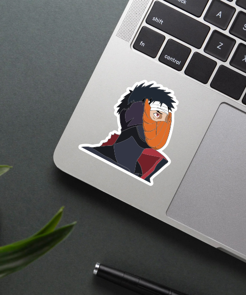 obito uchiha naruto sticker on laptop surface showing bold colors and clear design