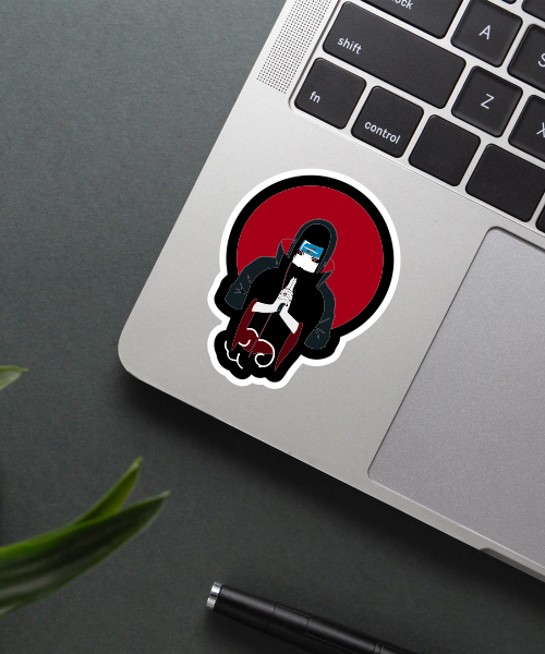 Itachi Uchiha sticker on laptop surface showing vibrant colors and clear details
