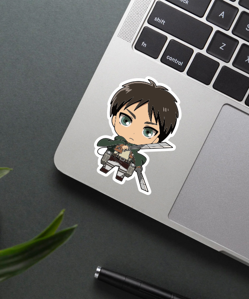 chibi eren sticker on laptop surface showing cute anime character with swords