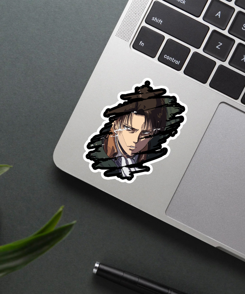 levi attack on titan sticker on laptop surface showing fierce expression and black brush strokes