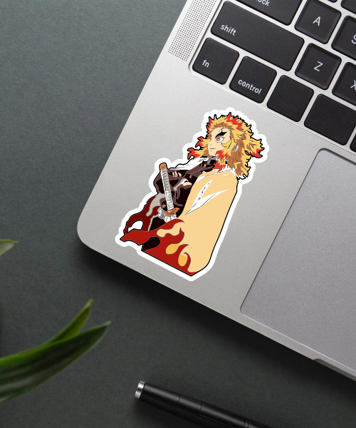 kyojuro rengoku anime sticker on laptop surface showing fiery hair and bold colors
