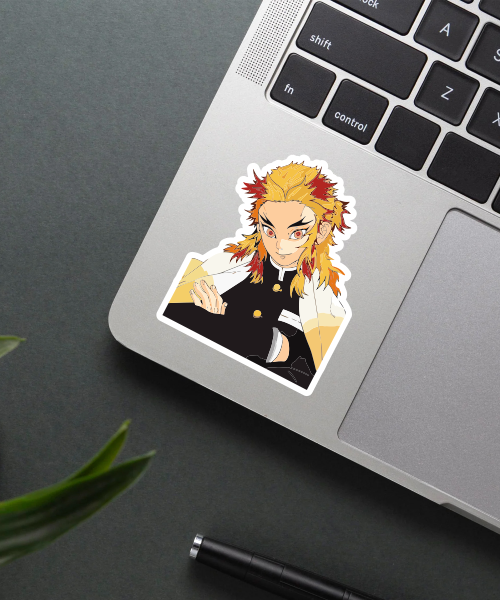 rengoku demon slayer sticker on laptop surface showing vibrant flame colors
