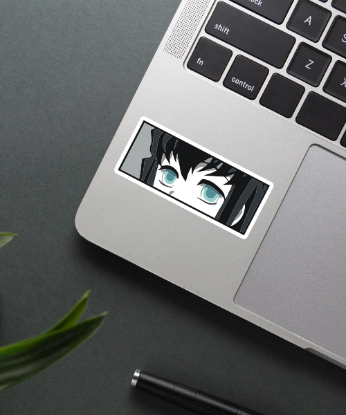 muichiro tokito anime sticker on laptop surface showing cool blue eyes and sleek design