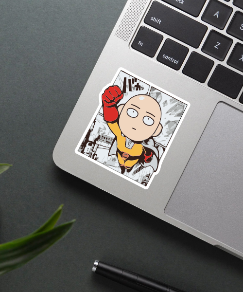 saitama manga chibi sticker on laptop surface showing comic panel style and vibrant colors
