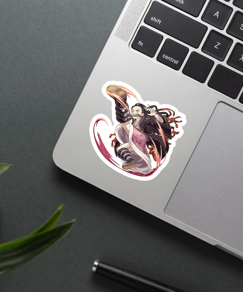 nezuko kamado demon slayer sticker on laptop surface showing action pose with flames