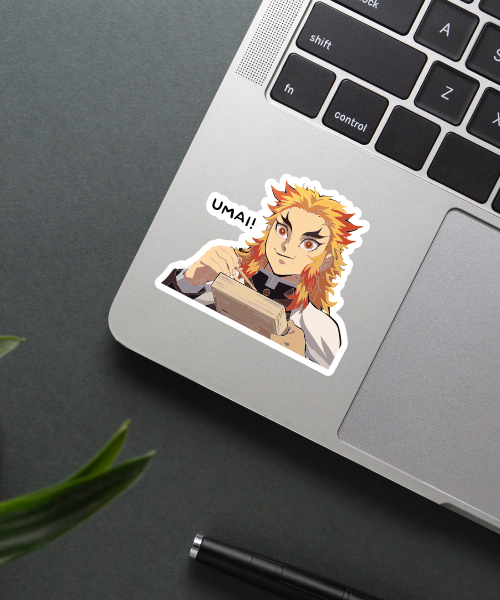 demon slayer rengoku sticker on laptop surface showing bright colors and Umai text